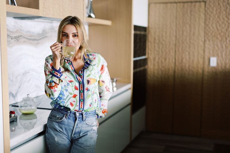 Raquel, our founder, sipping MŪZ Tea
