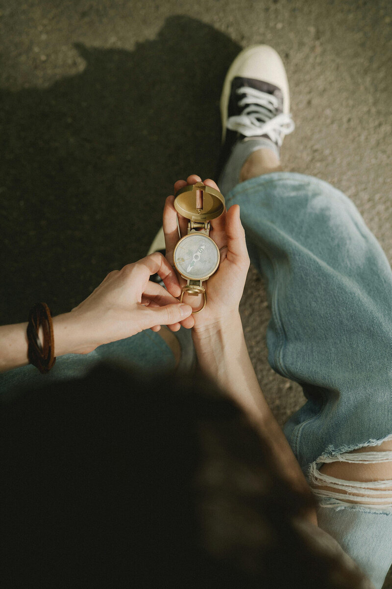 Person holding a compass, symbolising Financial Clarity and Direction.