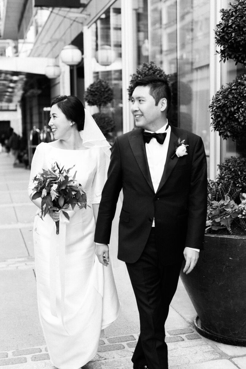 Black and white photo of couple outside Boston Ritz