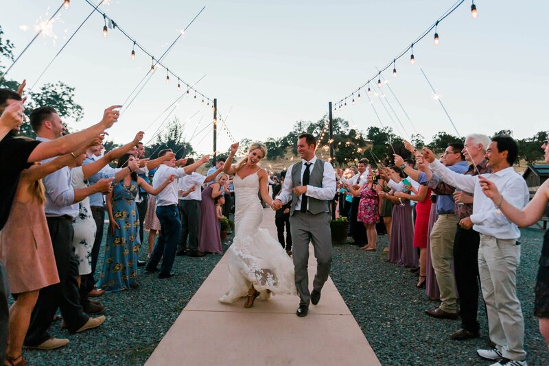 bride and groom dancing during their sparkler exit