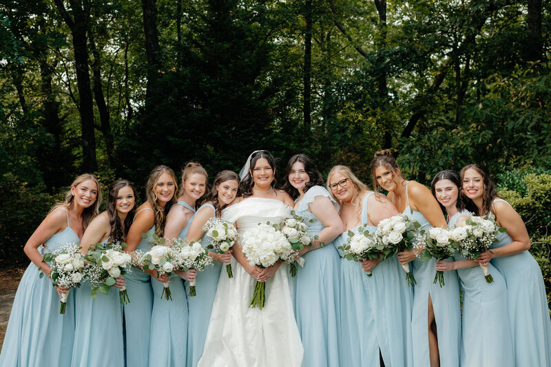 a bride and her bridesmaids in the woods near tacoma wa photographed by alabama and washington wedding photographer sarah mismash
