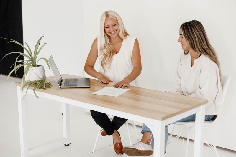 Professional setting showcasing a service provider engaging with a client in a well-lit office.