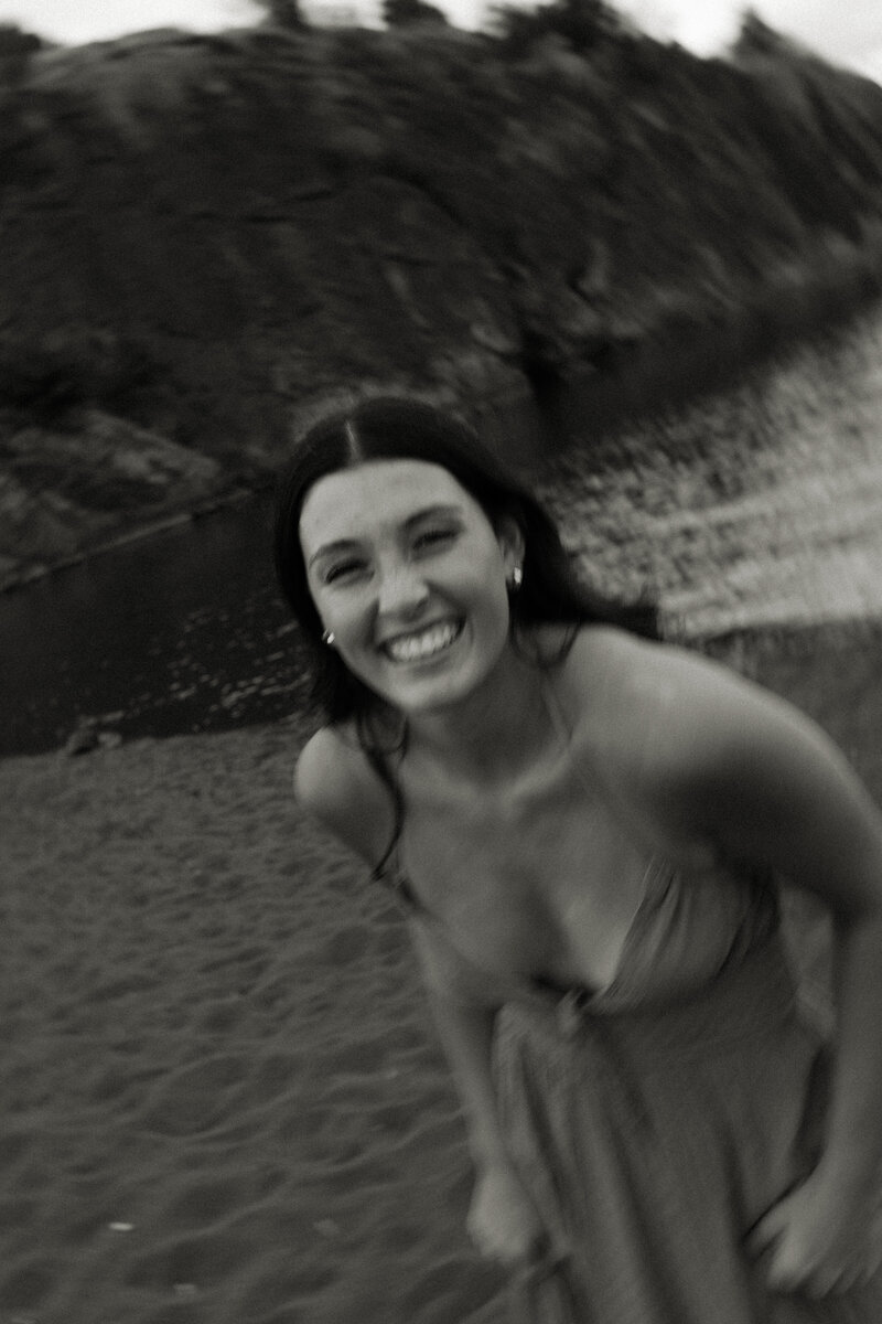 Melody runs along Black Beach in Silver Bay during her Minnesota senior pictures.