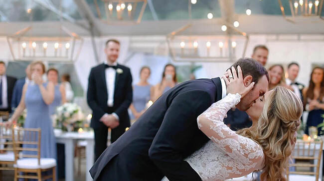 Bride and groom kissing during first dance