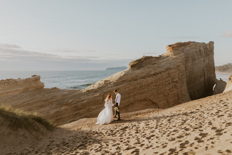 bride and groom on beach in oregon