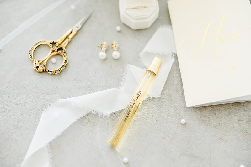 White and gold wedding details with pearls.