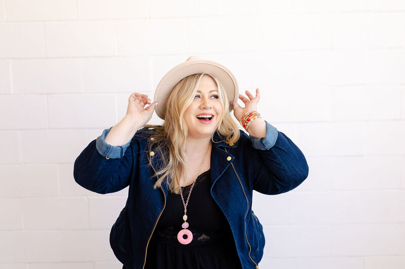 amanda macdowell smiling with pink hat