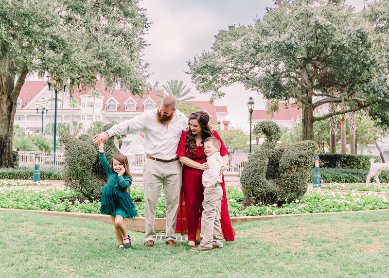 Christmas family photoshoot at Disney's Grand Floridian, hugging, dancing