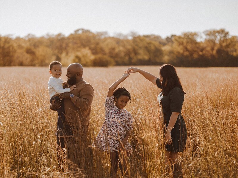 Outdoor photo of a young family of four