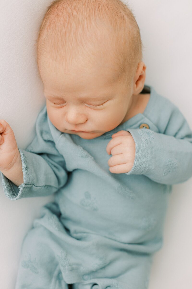 baby in blue newborn session in Lancaster, serving Harrisburg, Hershey