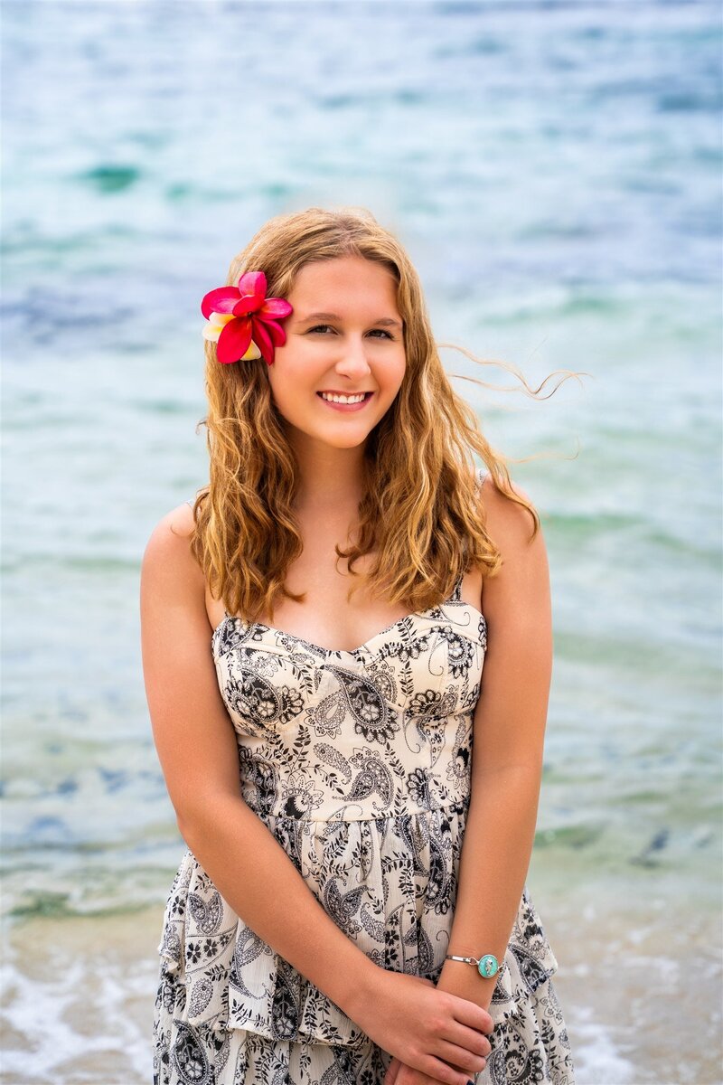 Senior photos of a girl with flower by individual portrait photographer hawaii