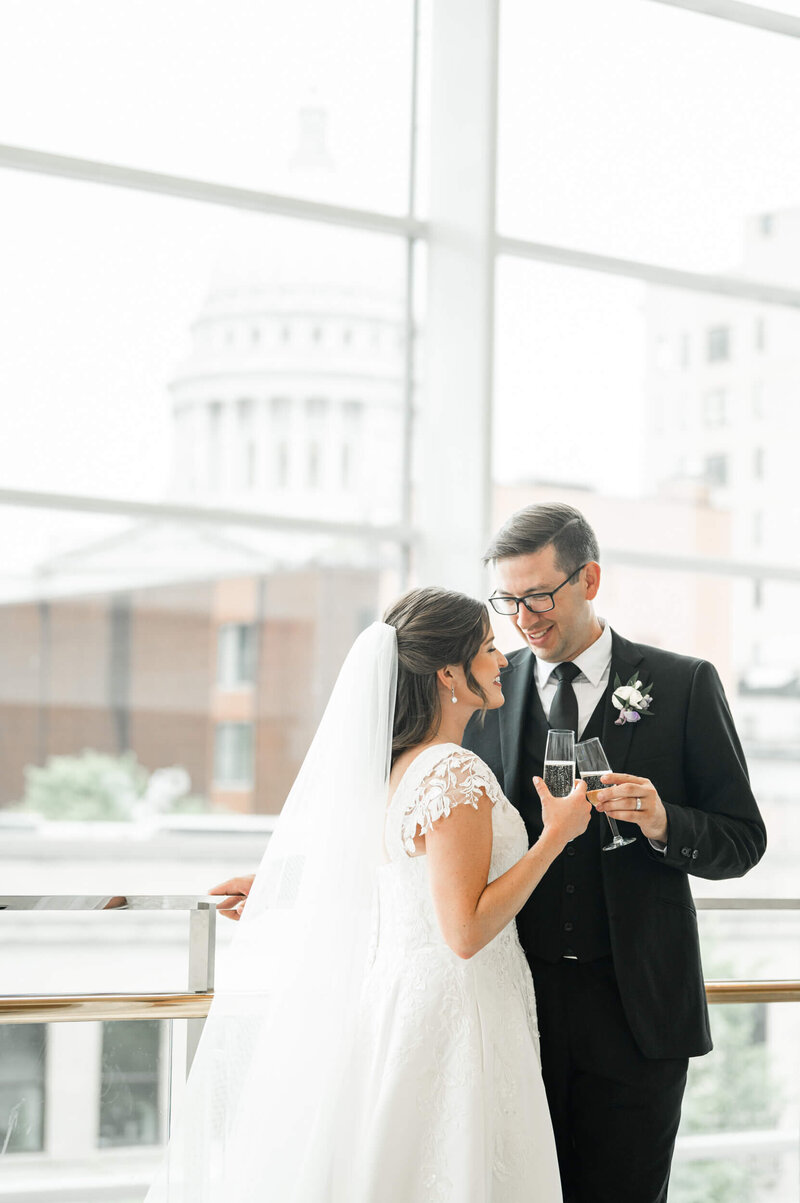 A bride and groom at The Overture Center by Madison, WI wedding photographers Morgan Madeleine Photography