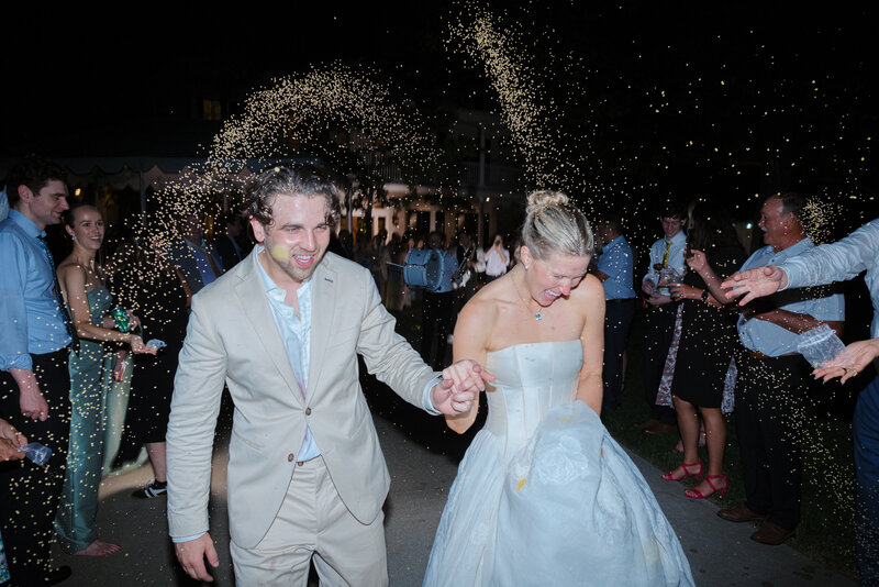 bride and groom twirling on blue checker dance floor at Mission Hills Country Club Kansas City wedding
