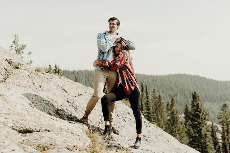 Relaxed couple standing on a mountain in Rocky Mountain National Park Colorado