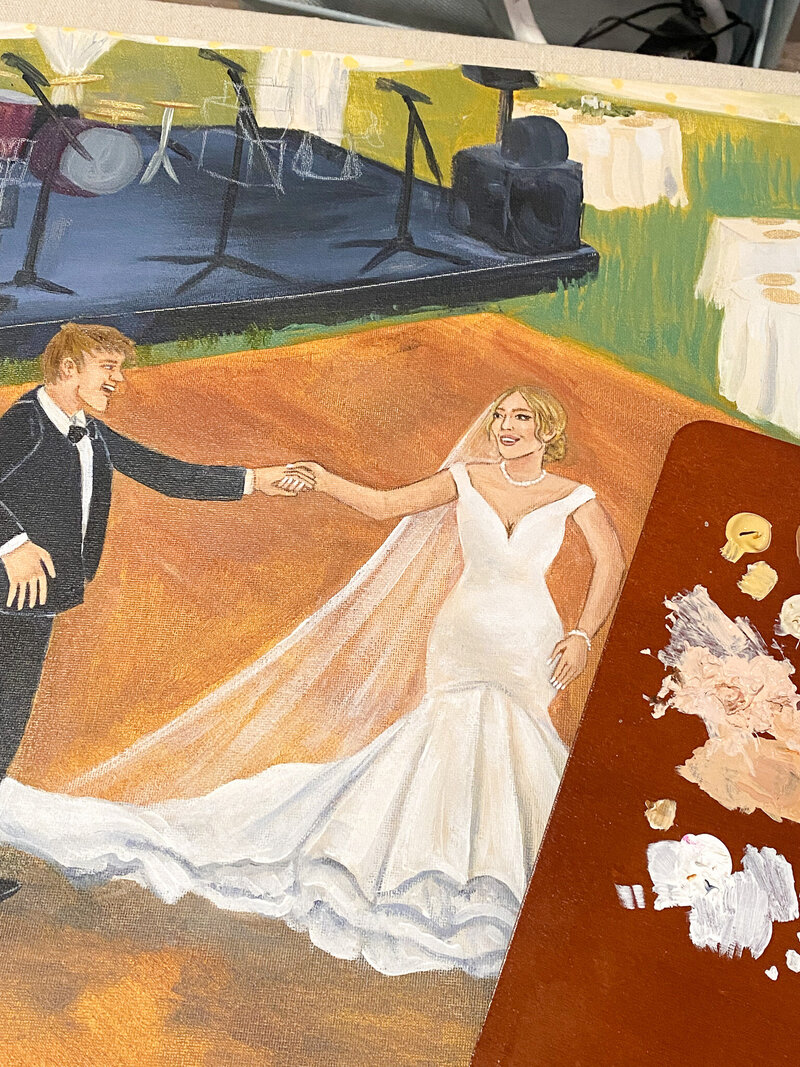Live acrylic painting of a couple's first dance at their wedding, capturing their joyful spin and smiles