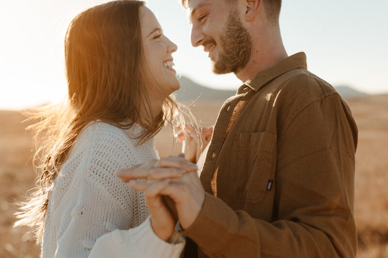 Couple's faces close together and smiling
