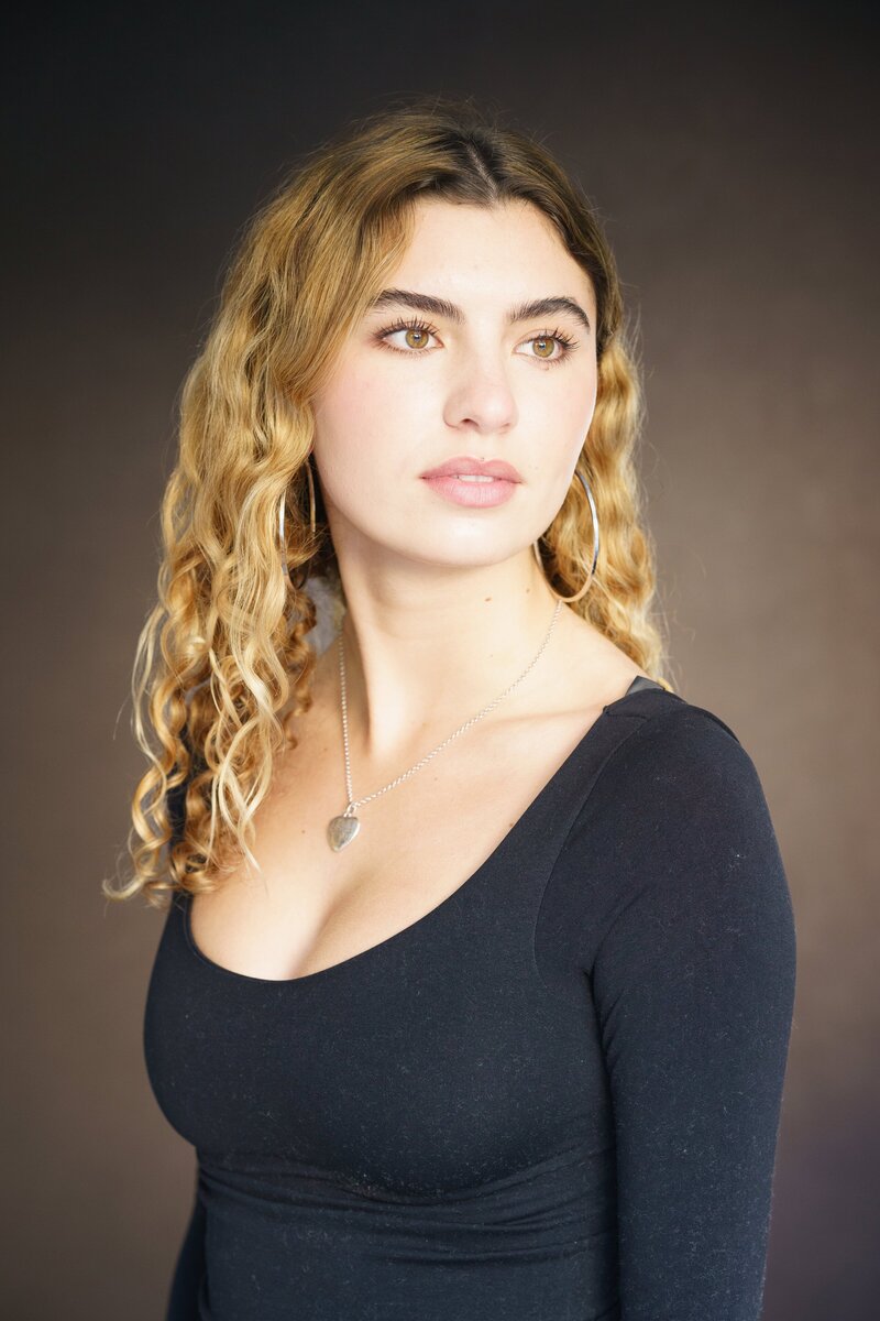 Professional headshot of a tech entrepreneur in San Francisco wearing a dark t-shirt with a serious look on his face