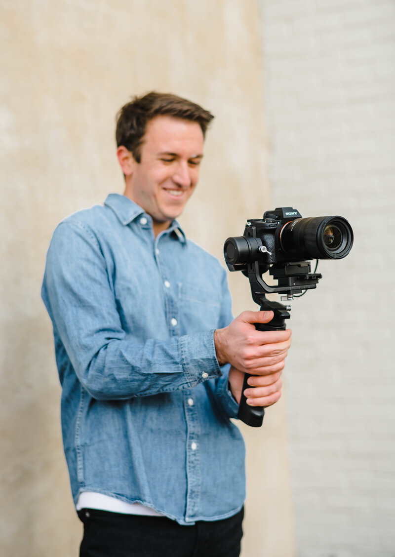 Michael Lemley Holds A Camera