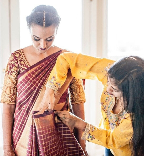 Chhavi draping a saree on a lovely client perfectly.