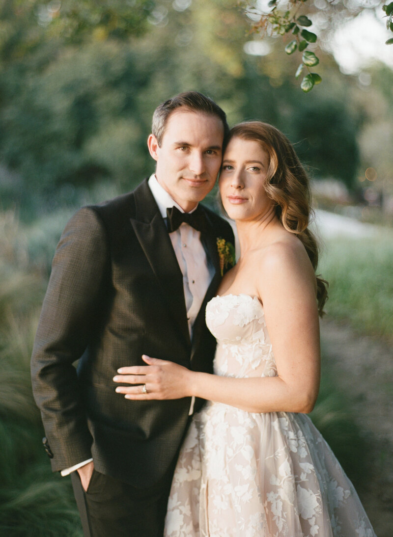 newly married couple almost kissing