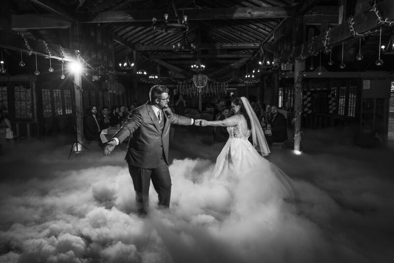 Shannon Lee, an Orlando wedding photographer capturing a magical first dance under sparkling fireworks and twinkling lights, surrounded by guests enjoying the celebration.