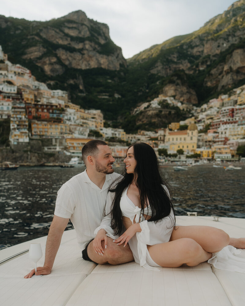 bride and groom running through grass