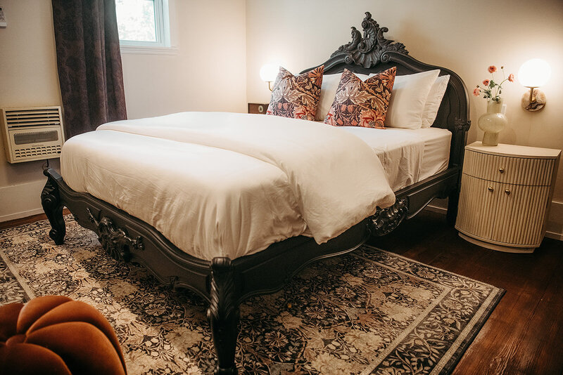 Little Blanco Suite - Queen room features and antique French headboard
