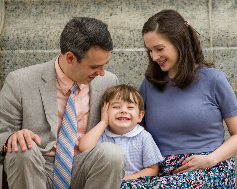 A little boy dressed for spring, striking a goofy pose during his Valley Forge mini session