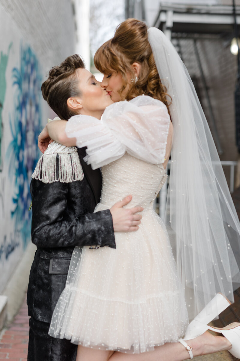 nonbinary wedding couple kissing in an alley way in Georgetown DC 