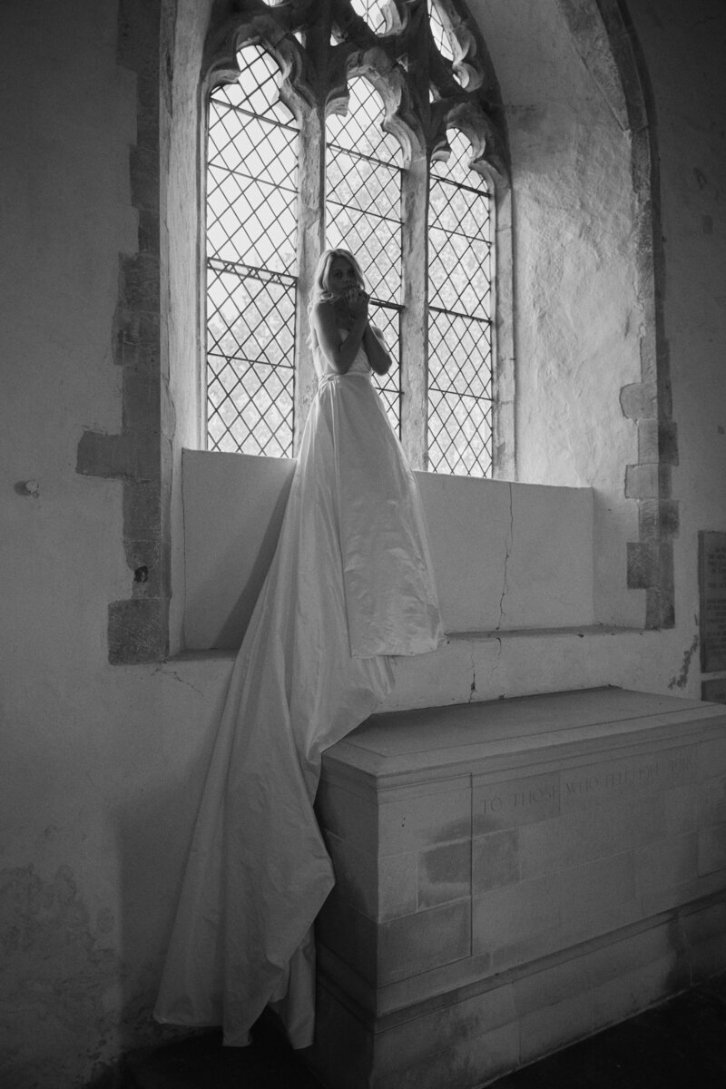 Bride wearing soft handmade silk corset wedding dress by British bridal designer Luna Bea