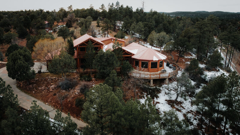 Ground view of a gorgeous stone chateau in a forest. 