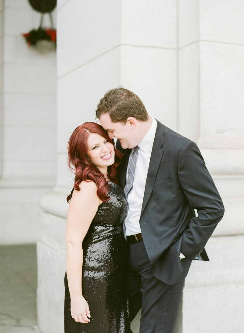 A couple snuggling in Washington DC for the engagement session