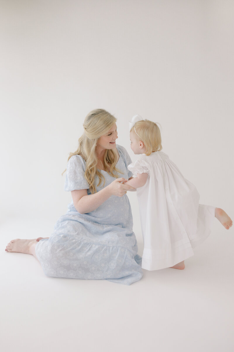 Mother daughter maternity shoot in Jessie Newton Photography studio in Vancleave, Mississippi.
