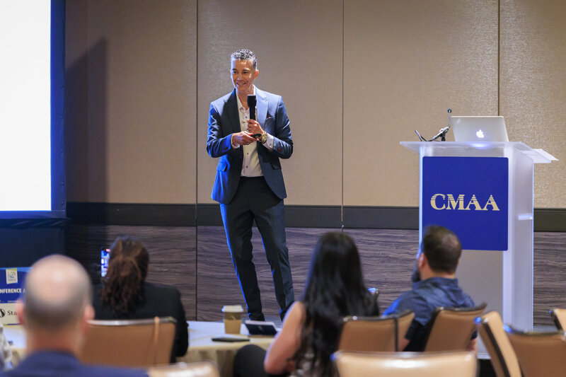 Marcia Alvarado Speaking at an Construction Industry conference for CMAA. 