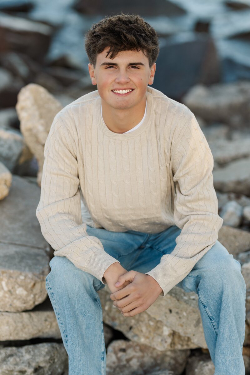 sister and two brothers smiling
