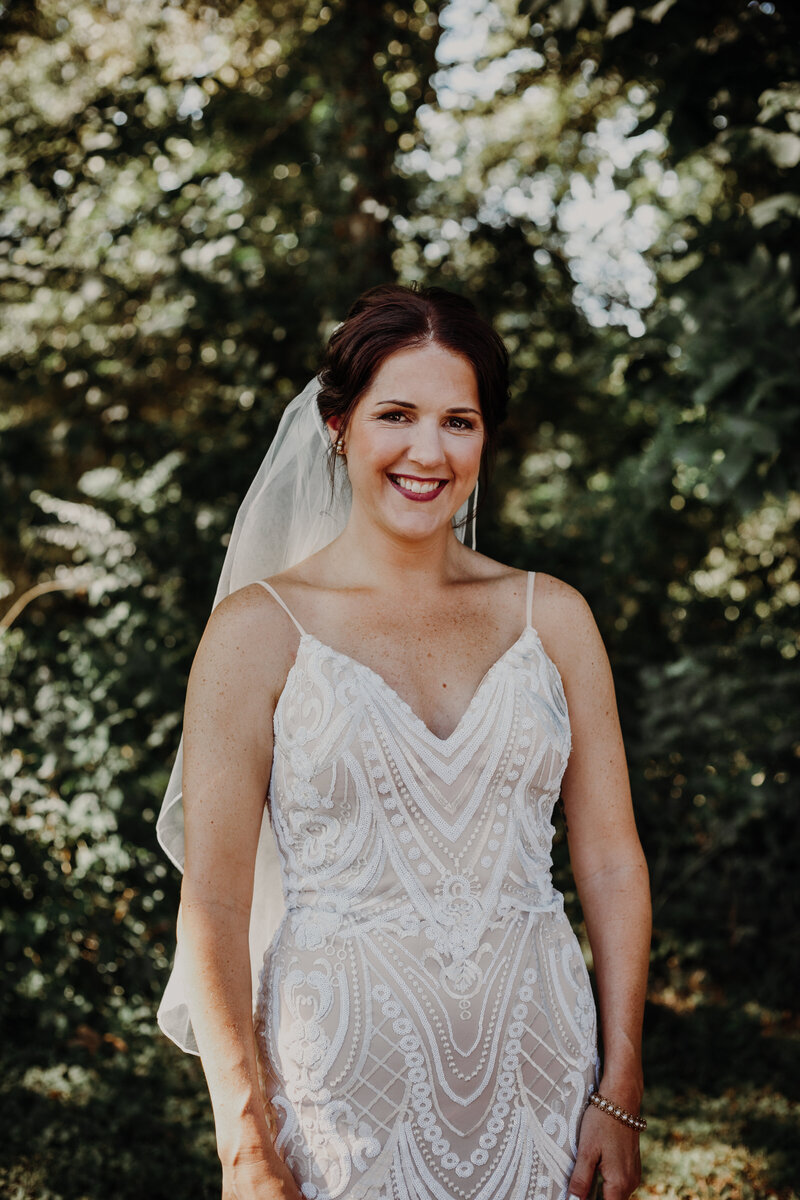 bride smiling wearing white dress