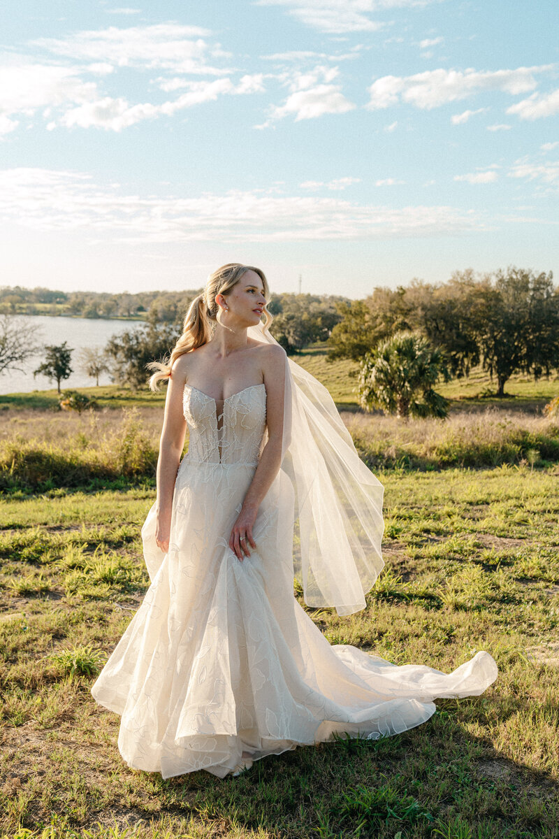 bride on her wedding day overlooking a picturesque lake view at Lakeview Gardens