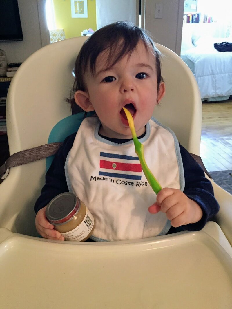 Ali's son with a spoon in his mouth