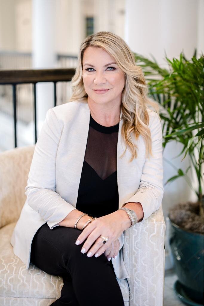Sheryl's vibrant lifestyle headshot features a warm smile, ideal for professional profiles and personal branding