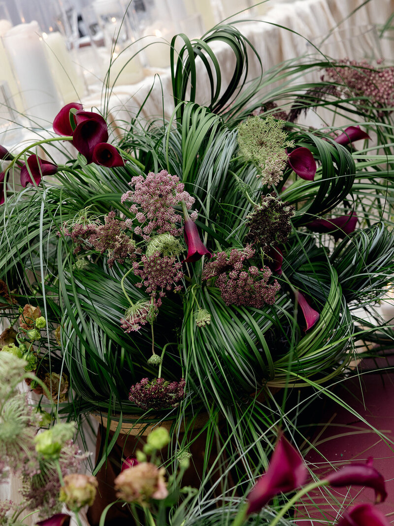Deep red and green floral arrangement