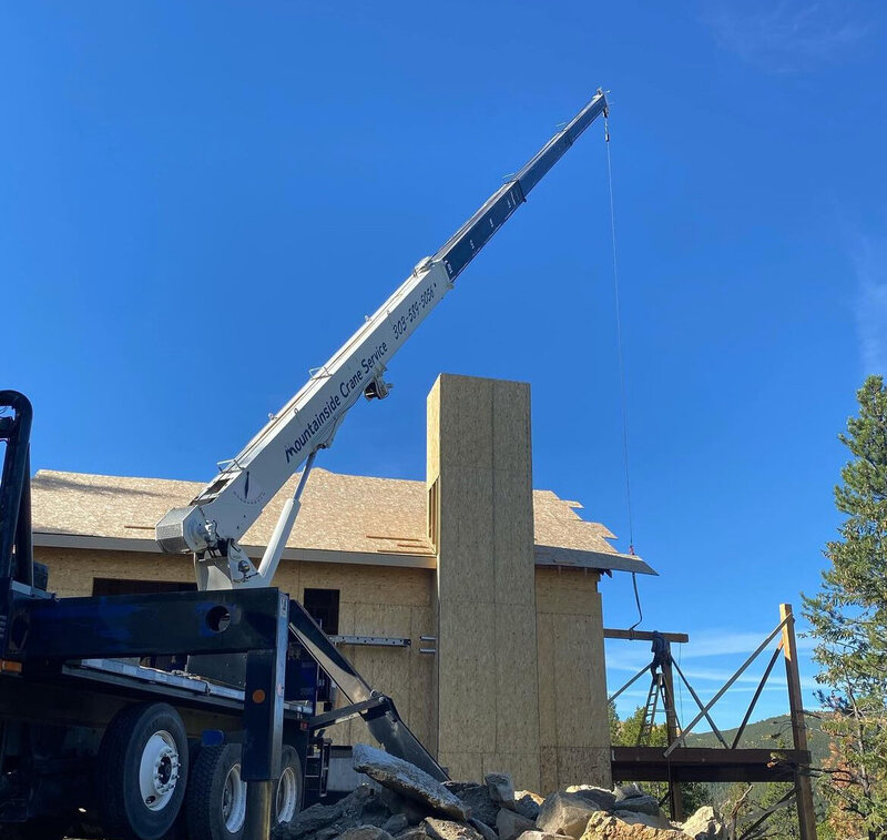 Crane-assisted beam installation in Colorado foothills