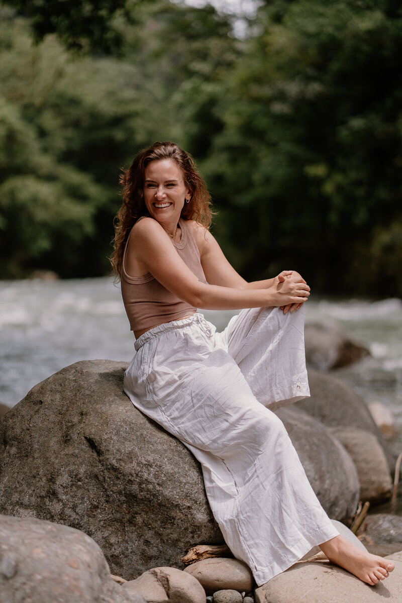 Writer and strategist for Sweet Talk, Lois sitting on a rock
