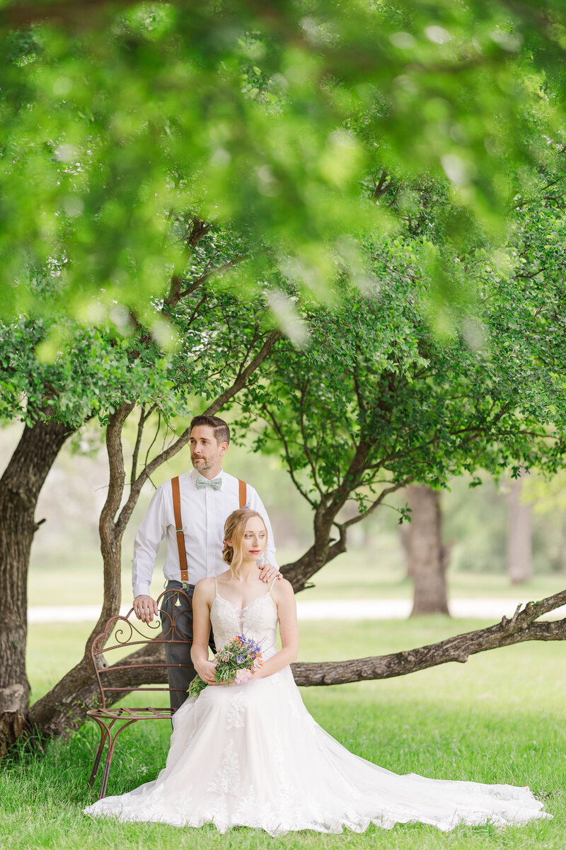 Bride-sitting-groom-standing