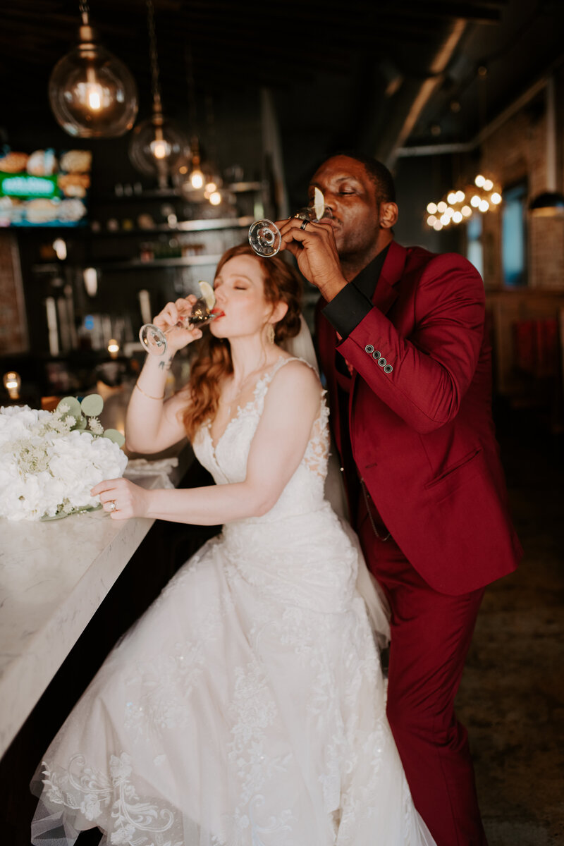 northern virginia elopement at a brewery in richmond, bride and groom drinking celebratory champagne