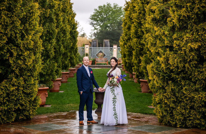 Pretty romantic gardens backdrop for a couple on their wedding day at Denver Botanic Gardens