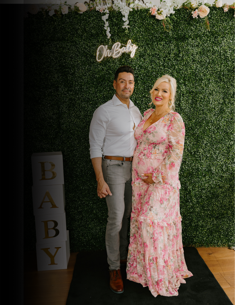 Photobooth picture of 2 people at a baby shower
