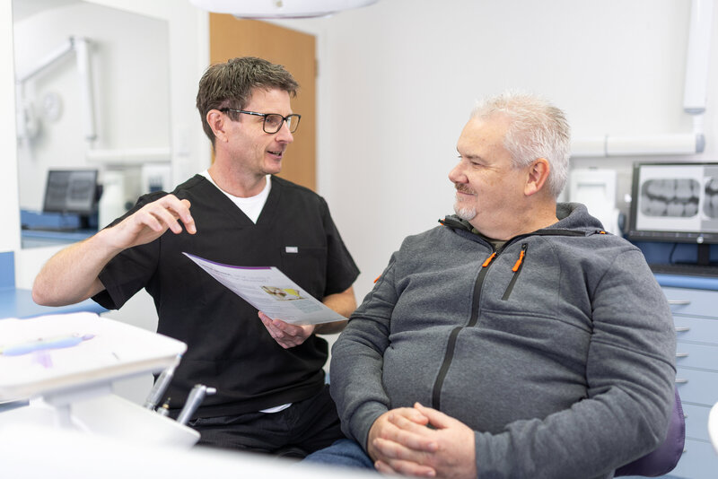 dentist and patient having a discussion