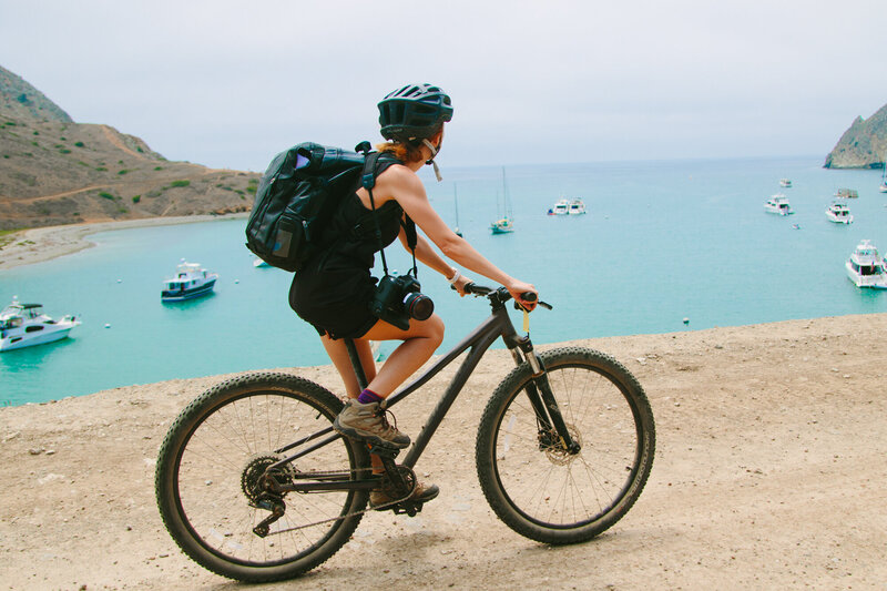 woman bikes on beach