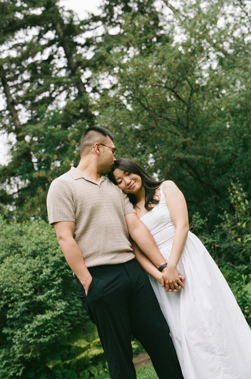 Film photo of young couple snuggle up with each other during Fernie engagement session