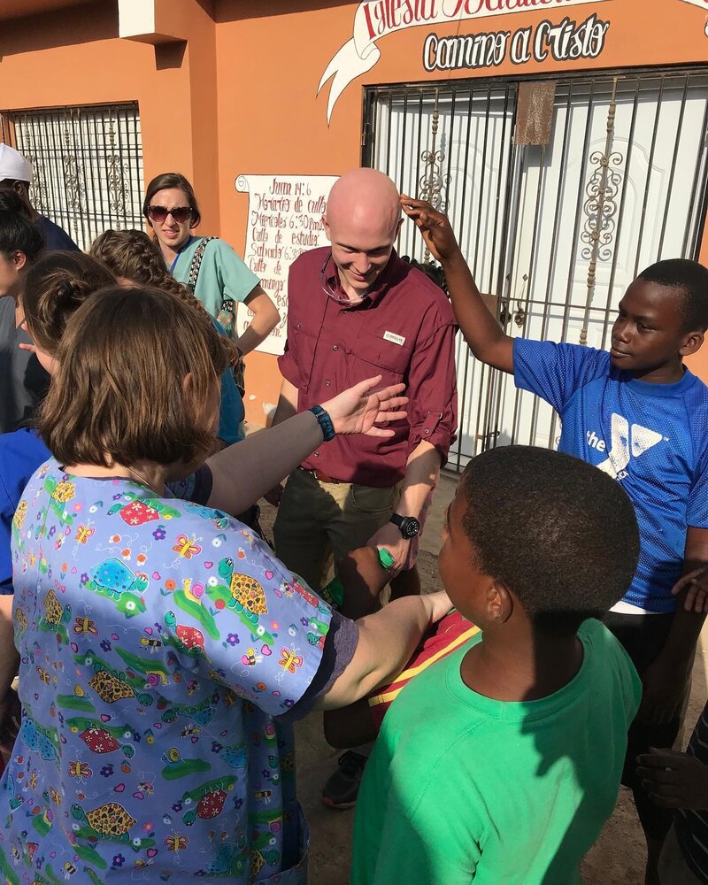 group of kids and doctor at mission trip
